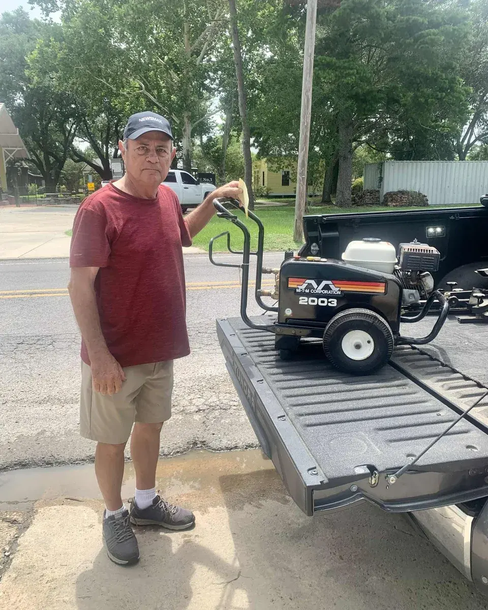 A customer with their machine at Cleaning Chemical Solutions
